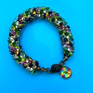 Holiday colors!  Kumihimo Magatama Beaded Bracelet withh colorful charm.